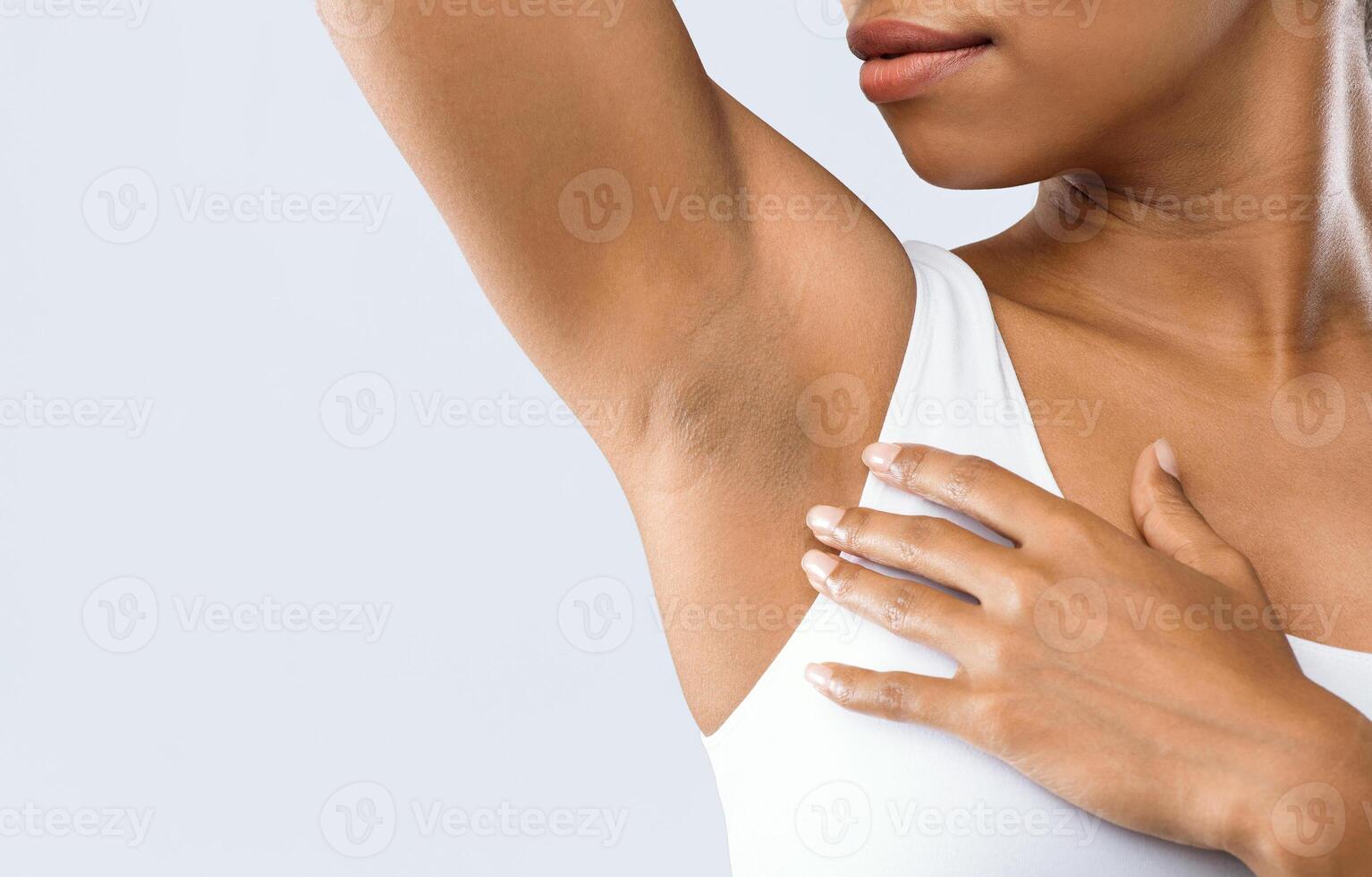 Cropped of black woman smelling her armpit, under arms hyperhidrosis, copy space photo