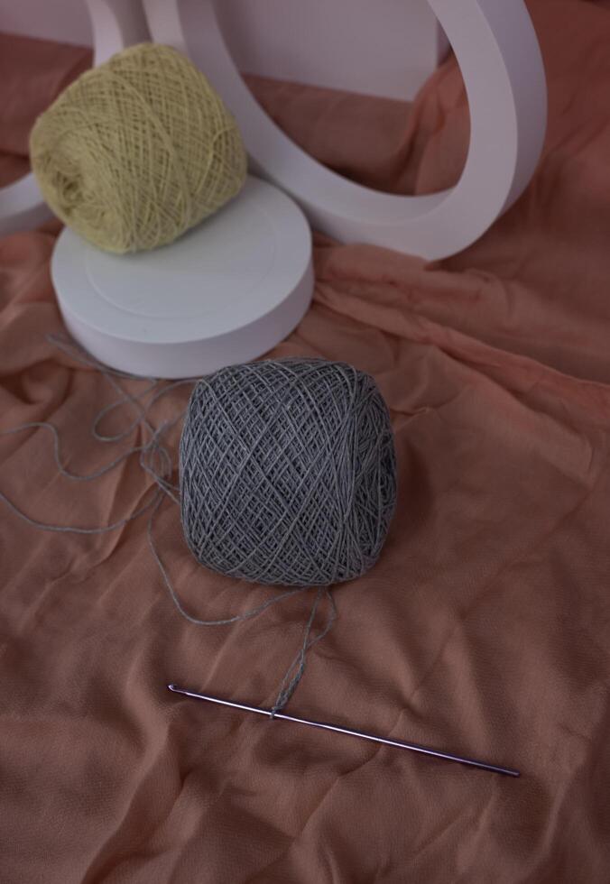 Crochet yarn and Hook put on background, photo