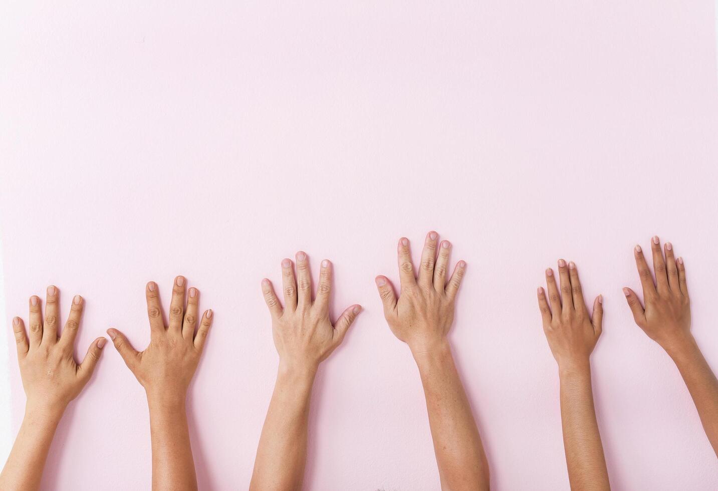 six hands raise up in the air photo