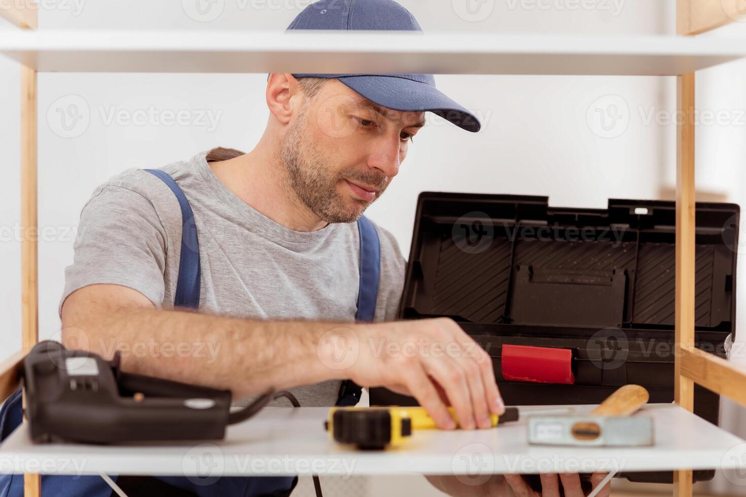 Carpentry Tools. Professional Carpenter Making Furniture Unpacking Equipment Before Work Indoor. Selective Focus photo