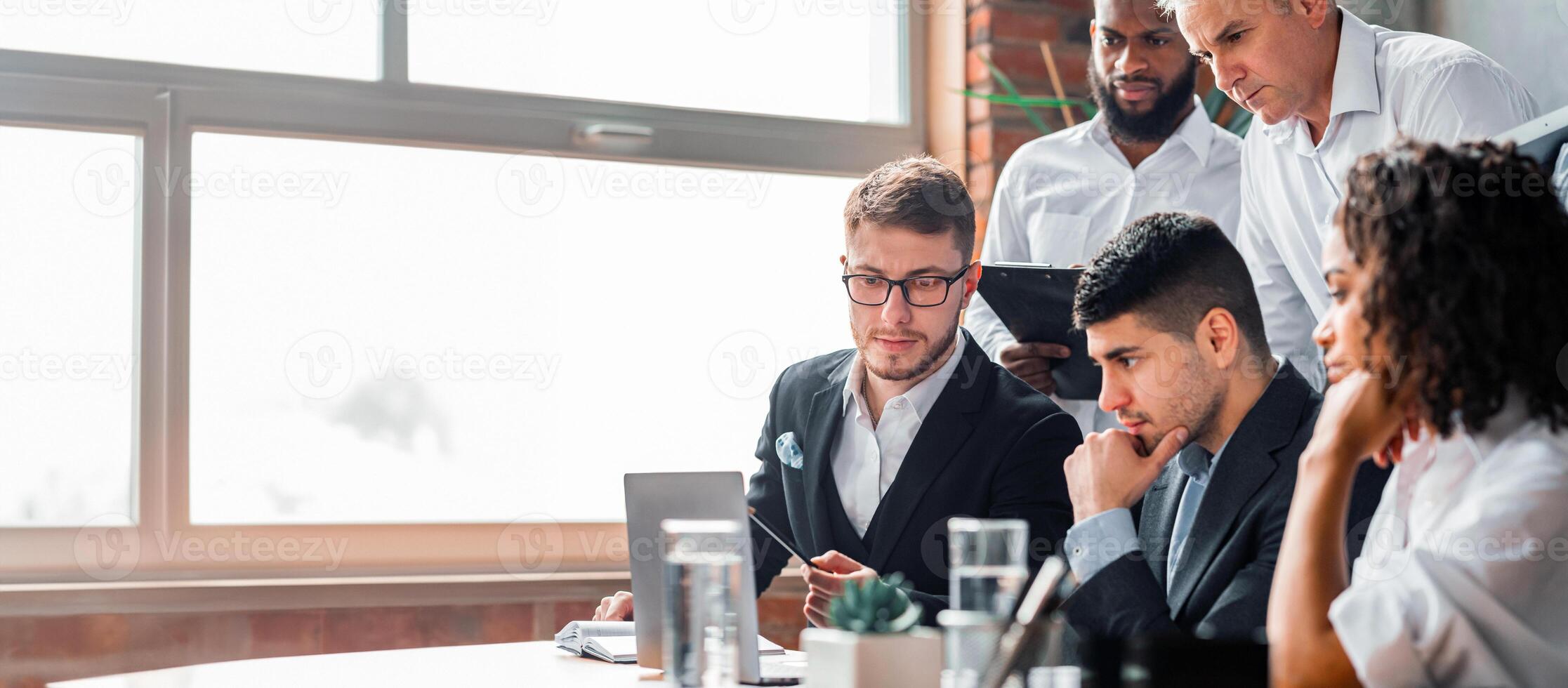 Business Crisis. Team Of Coworkers Sitting At Laptop Having Problem Thinking On Solution In Modern Office. Selective Focus photo