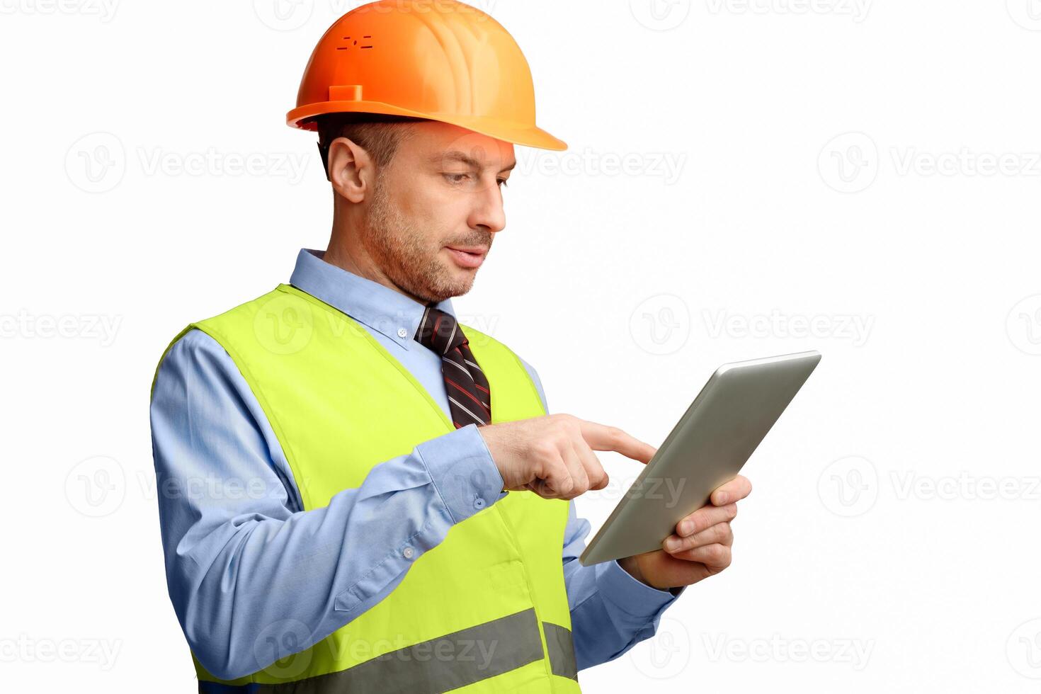 Building Engineer Using Digital Tablet Computer Standing On White Background. Industrial Engineering Concept. Studio Shot photo