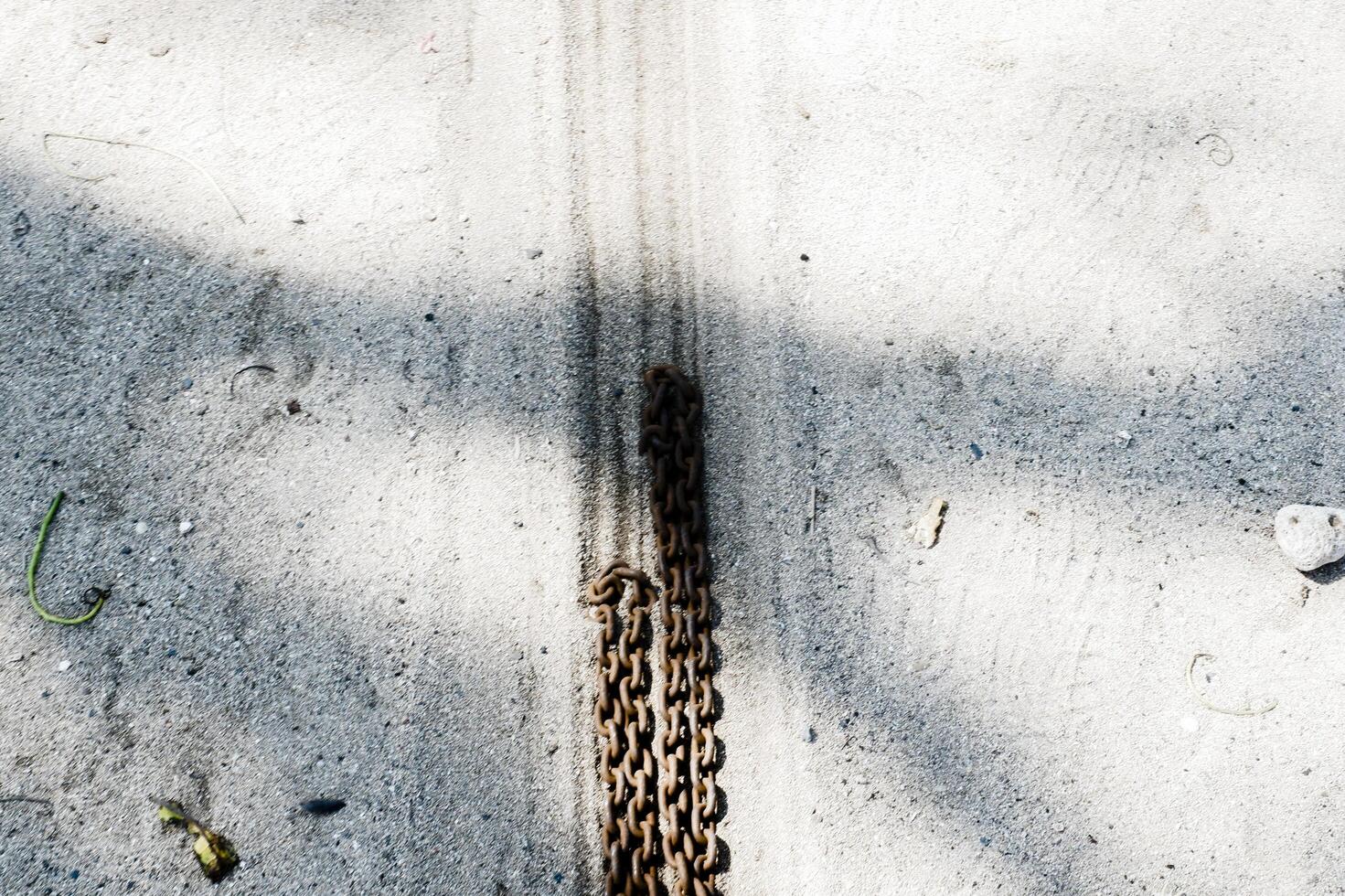 a chain is attached to a tire on a road photo