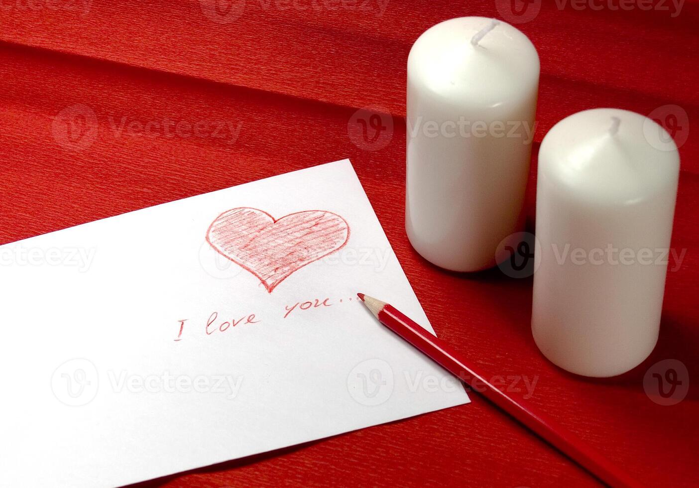envelope with red heart and two candles photo