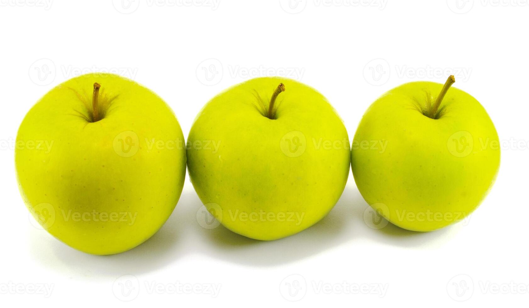 three fresh apples on white photo