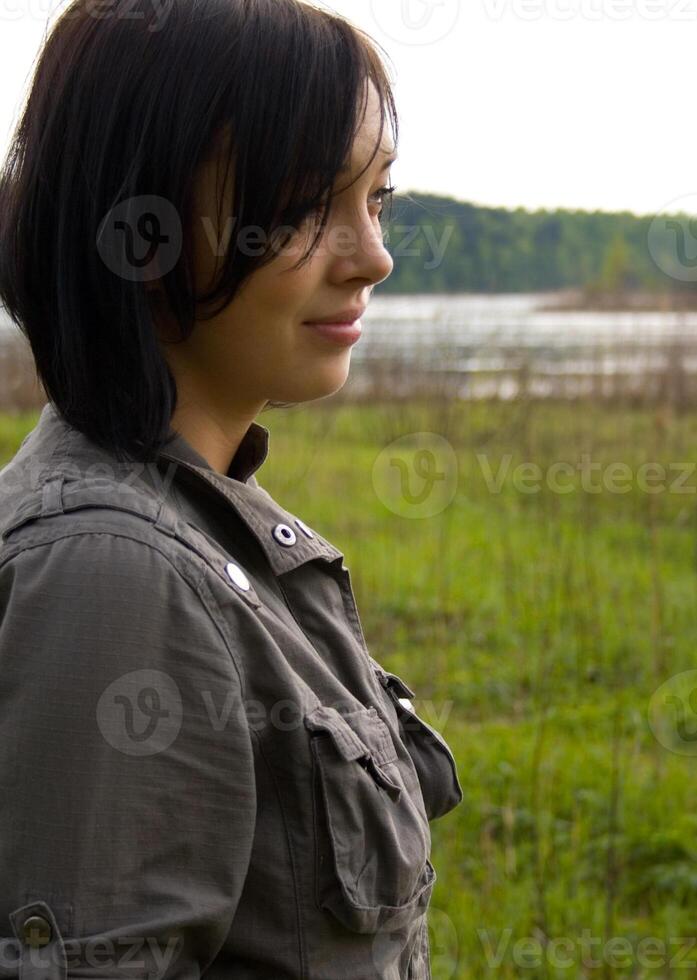 pretty brunette near lake photo
