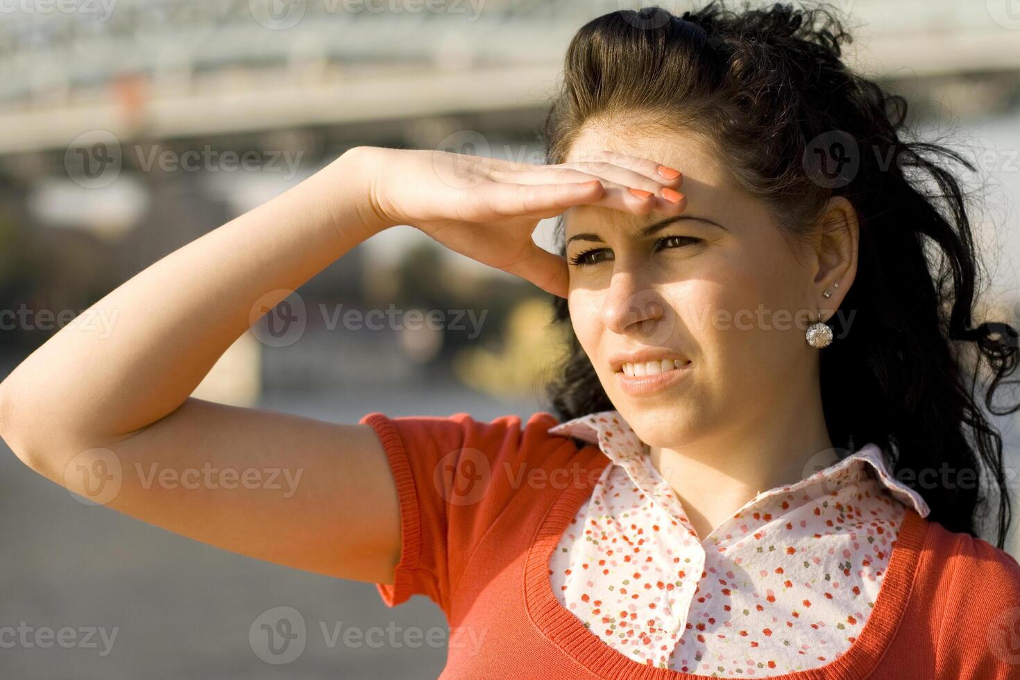 woman looking at river water photo