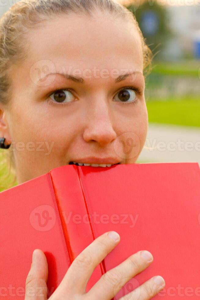 woman with red book photo