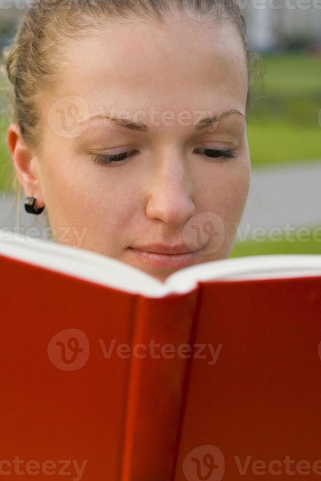 woman with red book photo