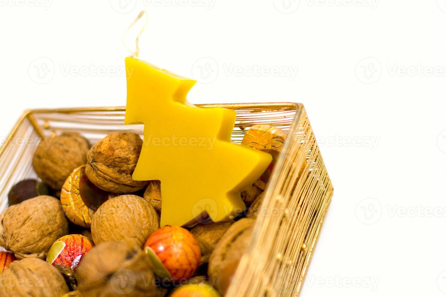 walnuts, sweets and handmade candle photo