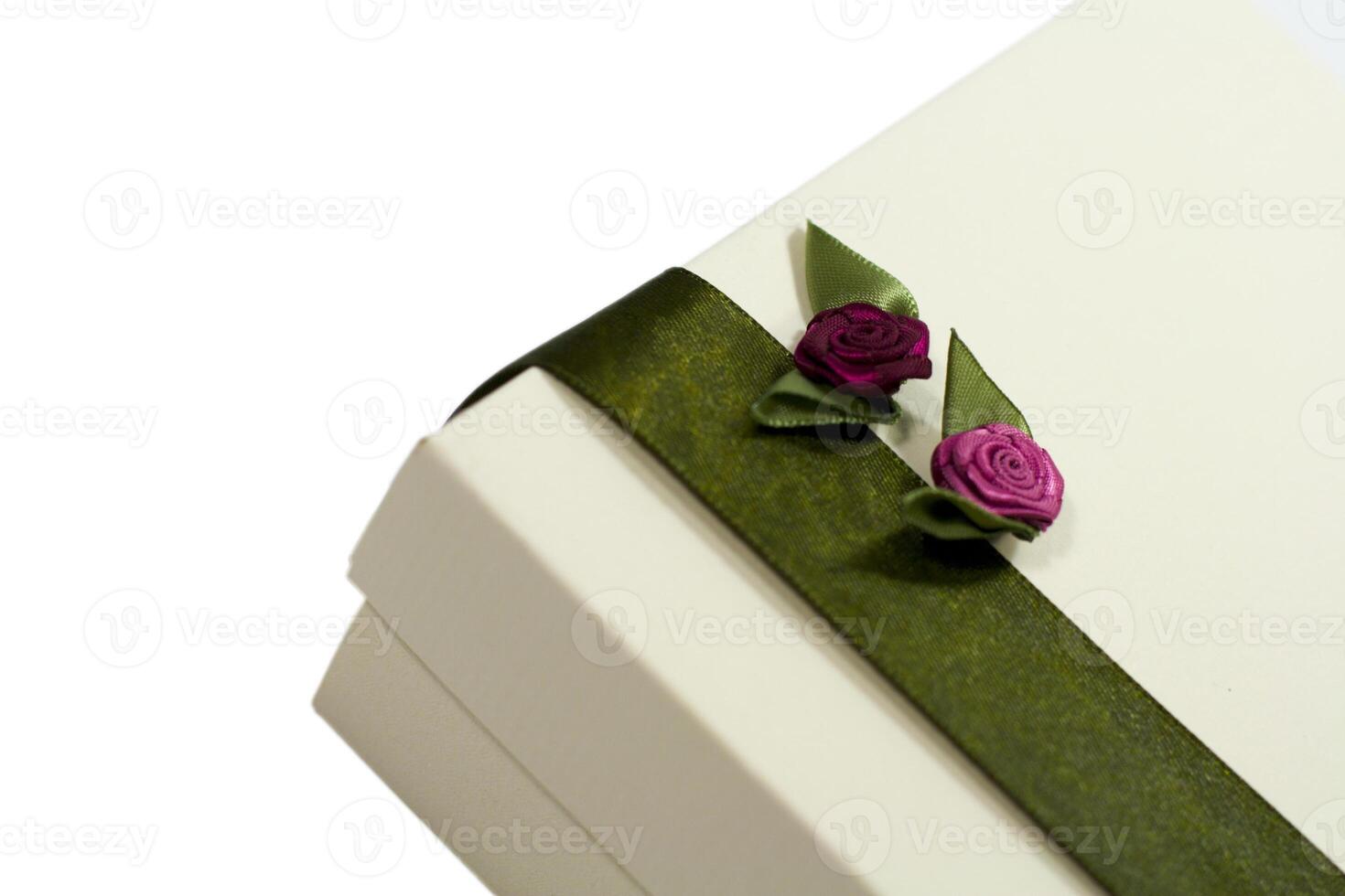 white gift box with green decoration photo