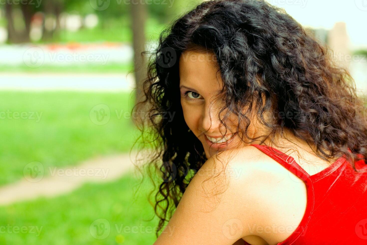 beautiful brunet woman in red photo