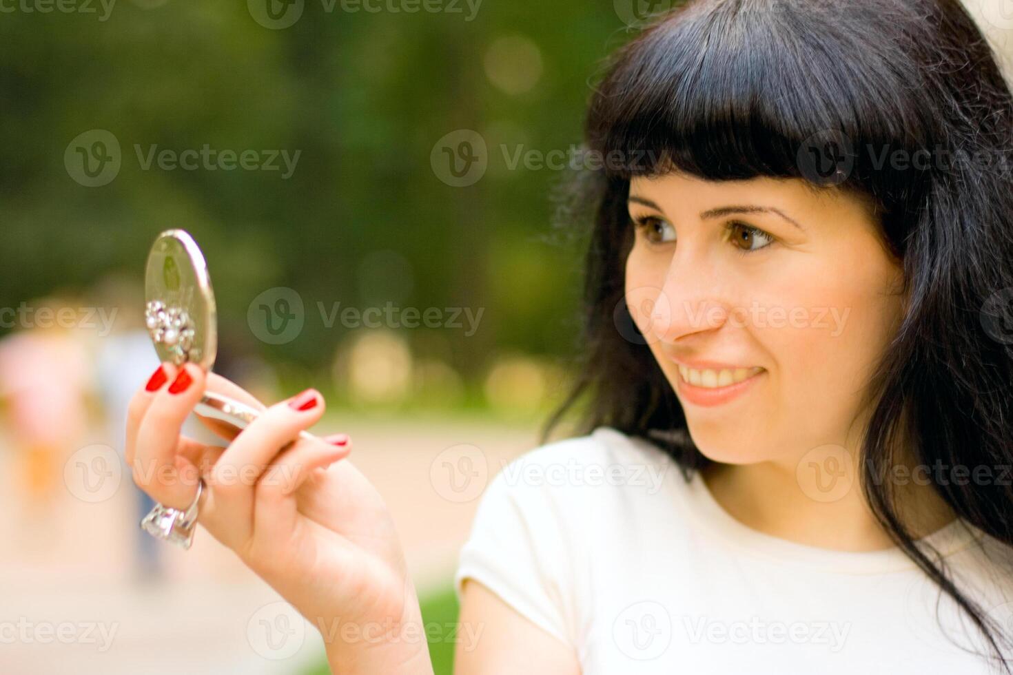 girl looking in the mirror photo
