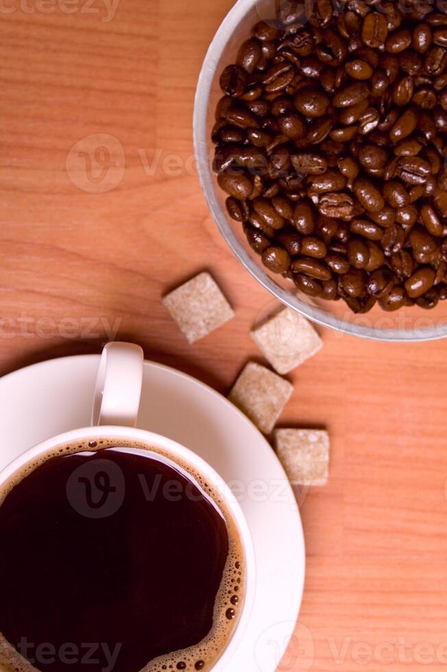 cup of coffee, beans and sugar photo