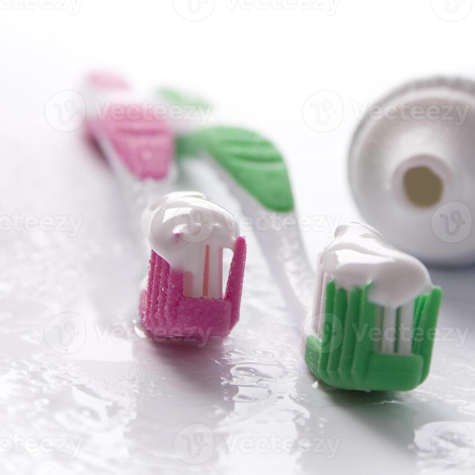 toothpaste and toothbrushes photo