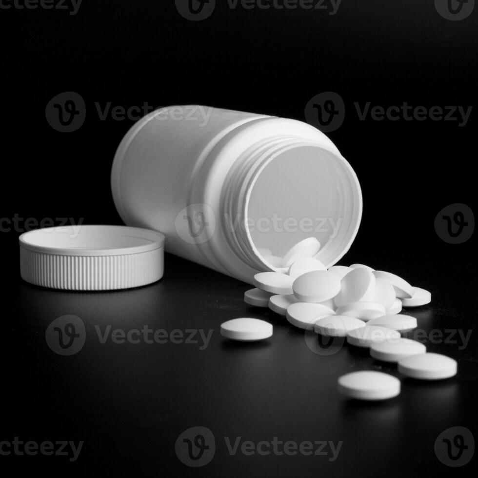 bottle with white pills photo