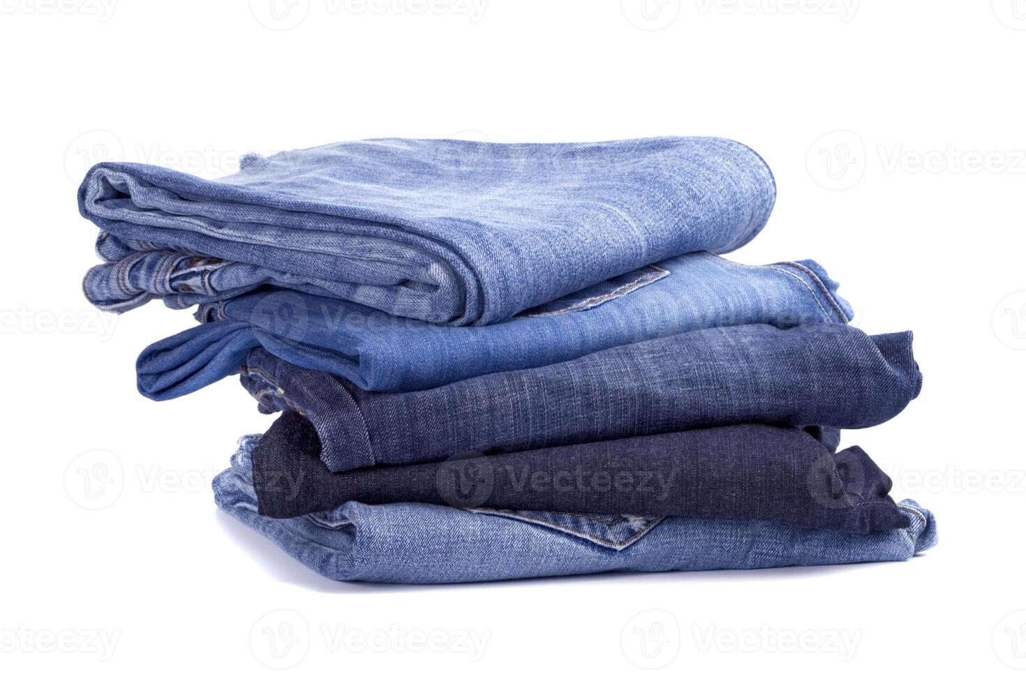 stack of blue jeans photo