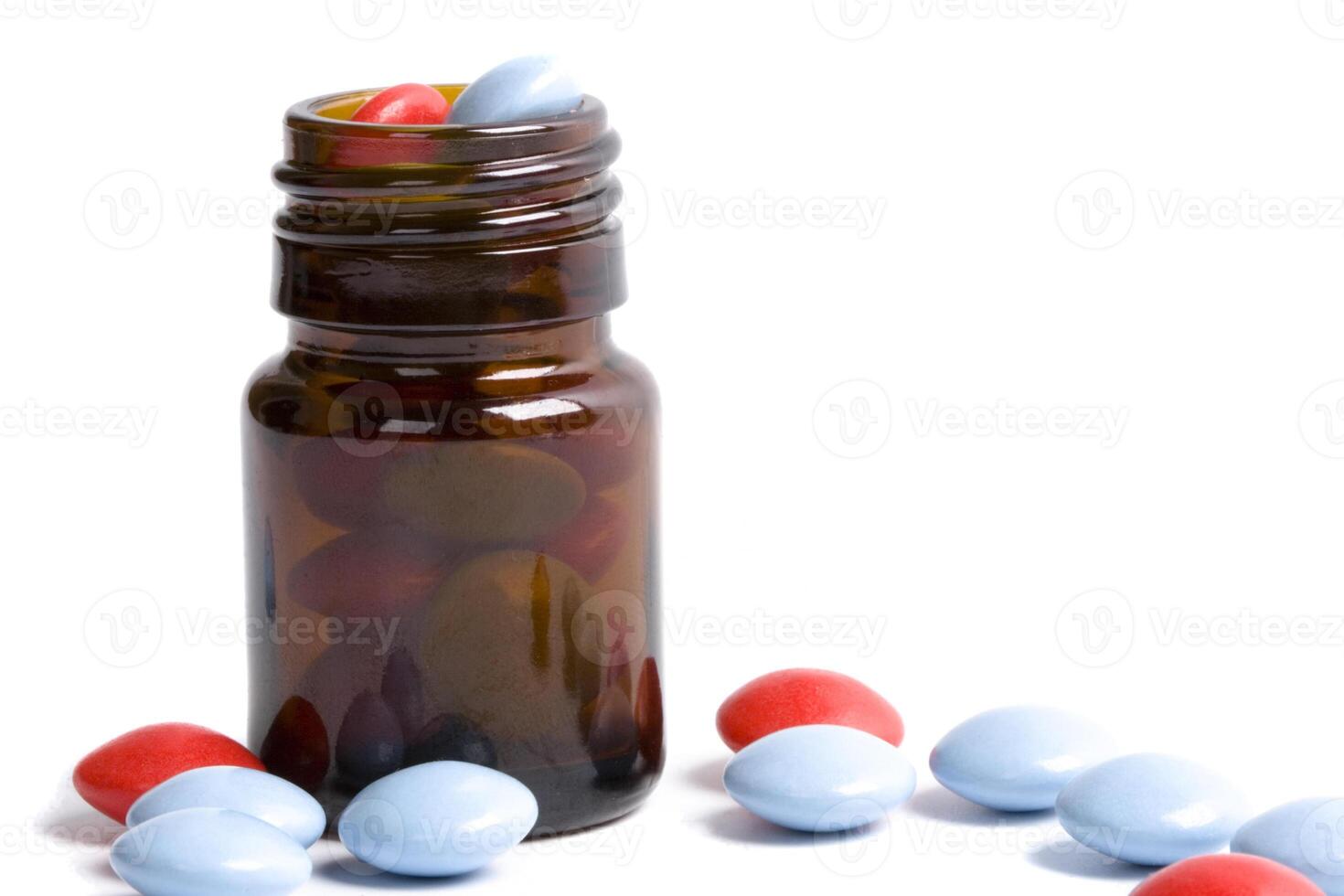 bottle with red and blue pills photo