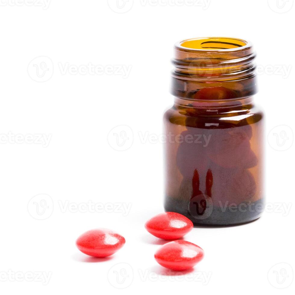 bottle with red pills photo