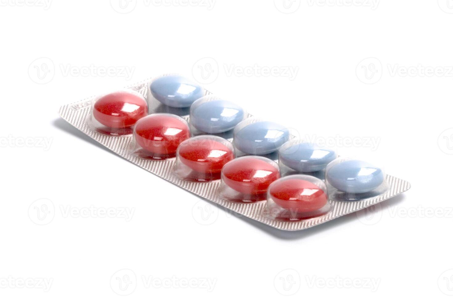 red and blue pills in plastic blister photo