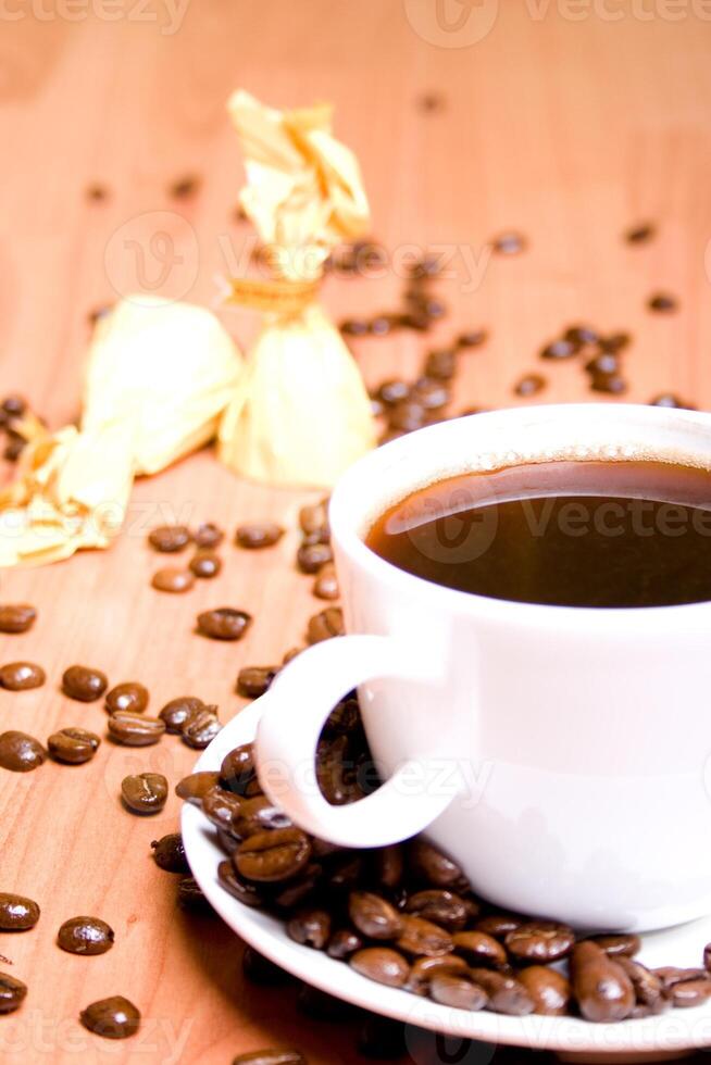 coffee, some sweets and beans photo