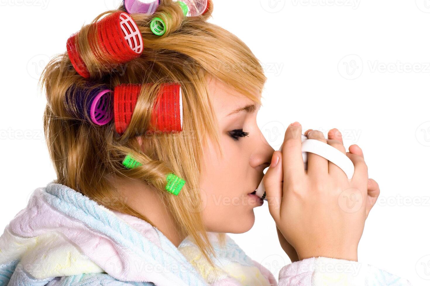 housewife with curlers and cup photo