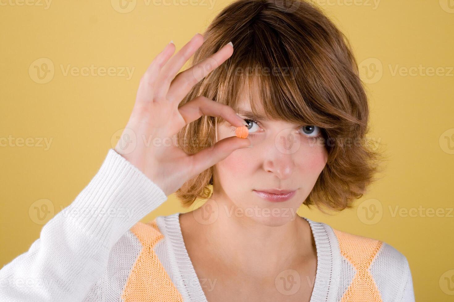 young woman with pill photo