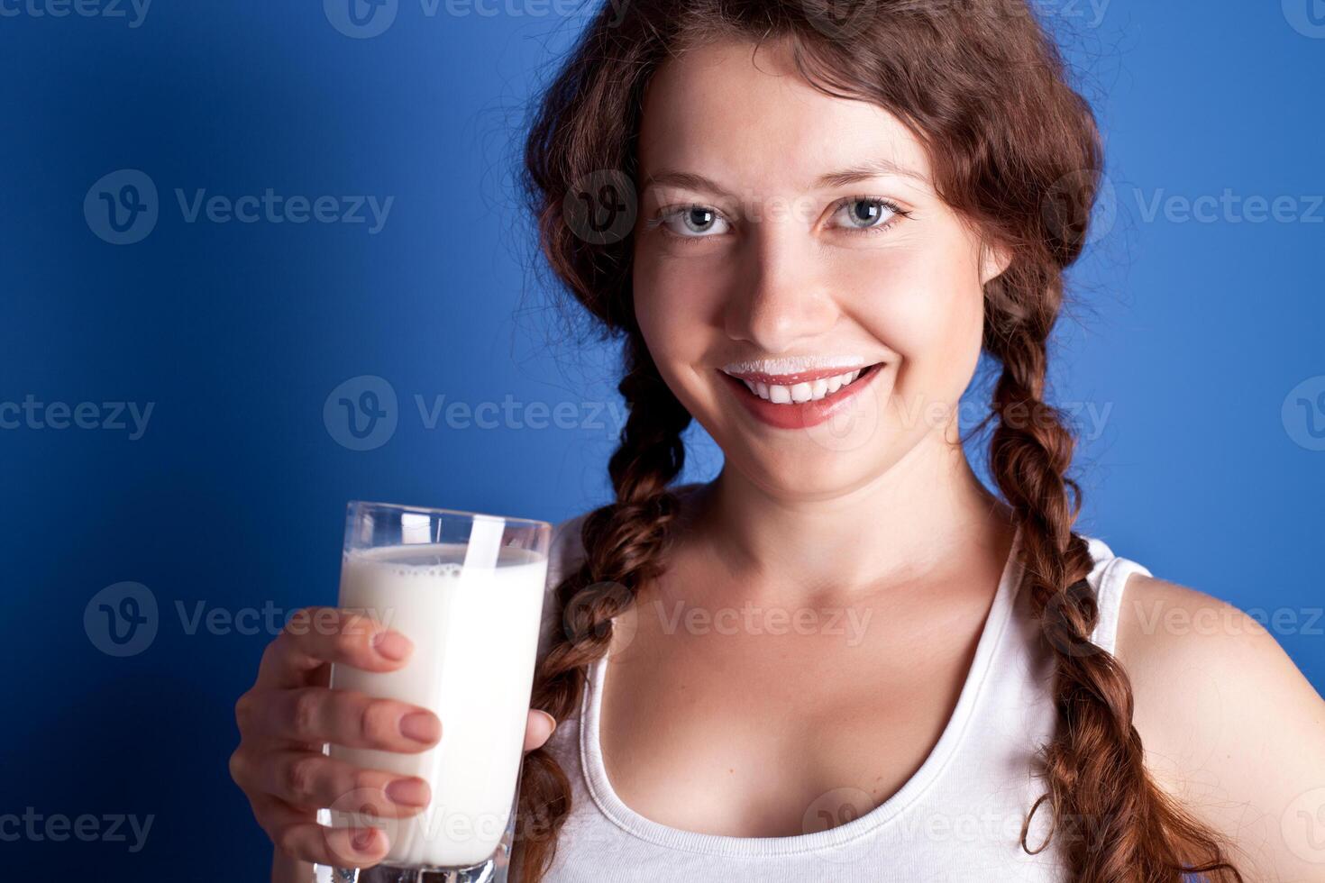 woman enjoying a glass milk photo