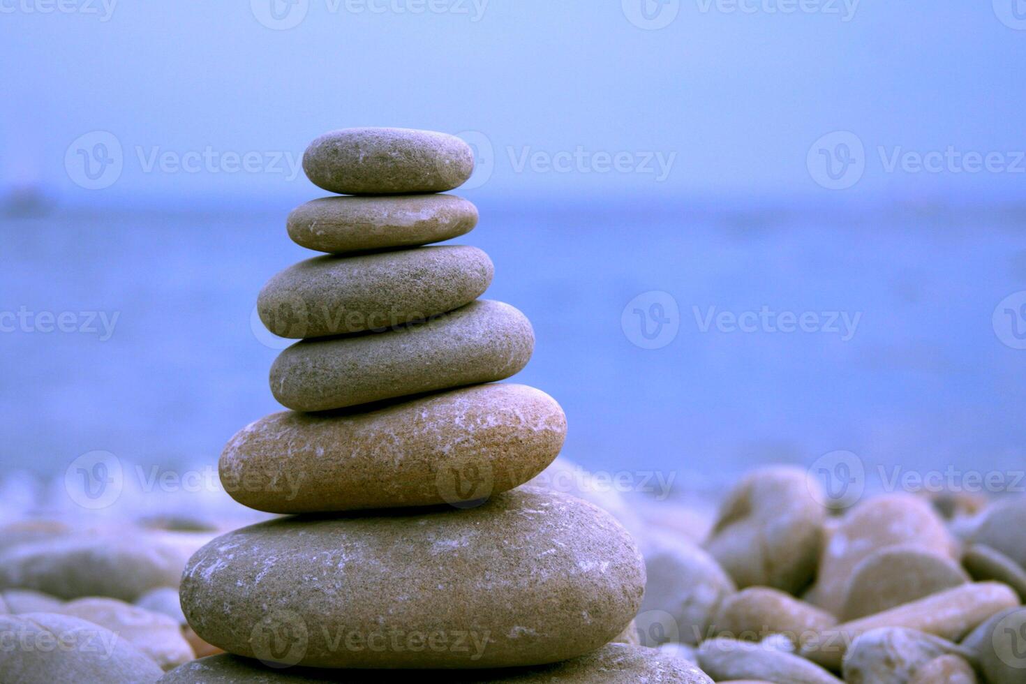 stone pyramid on the beach photo