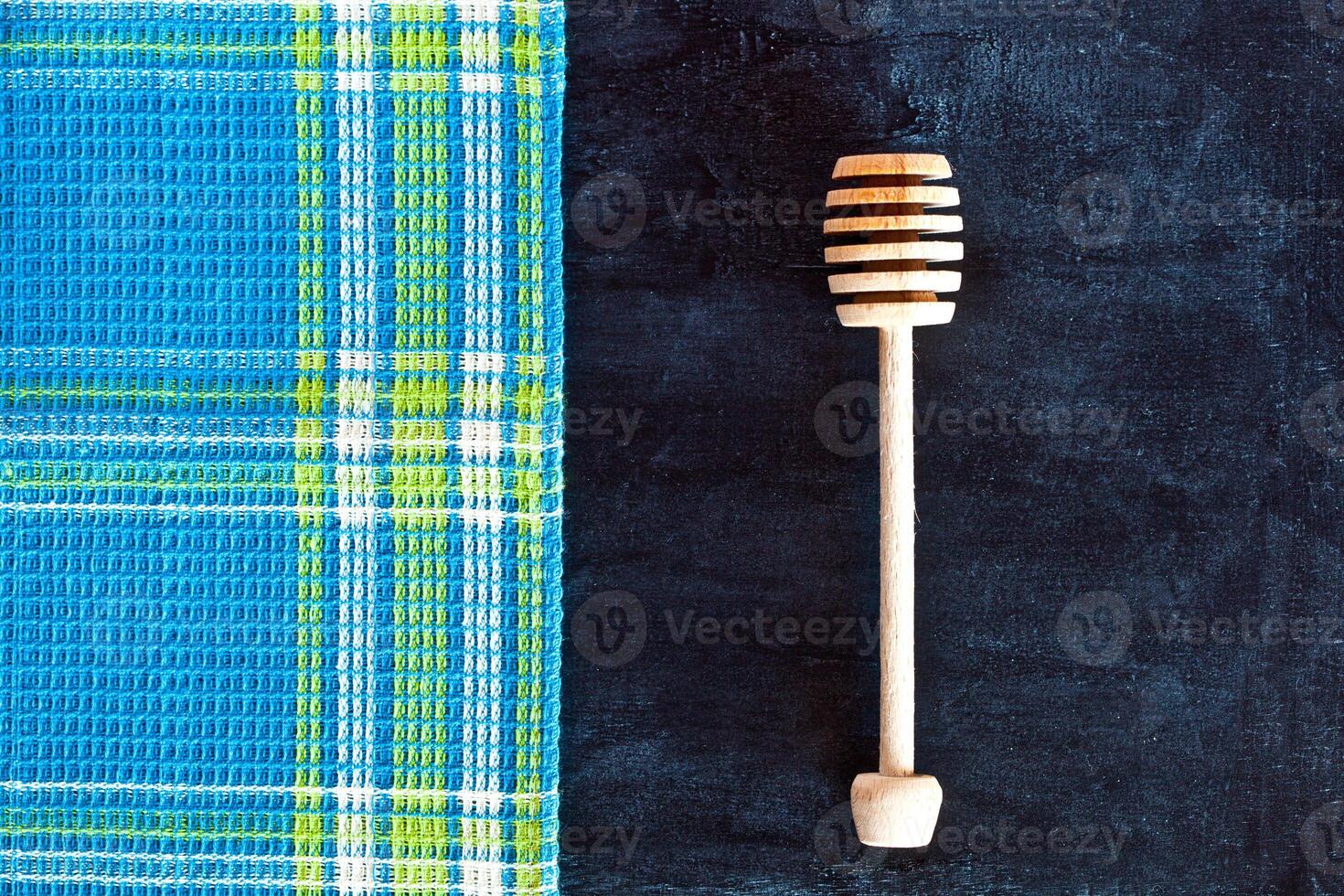 honey stick and tablecloth photo