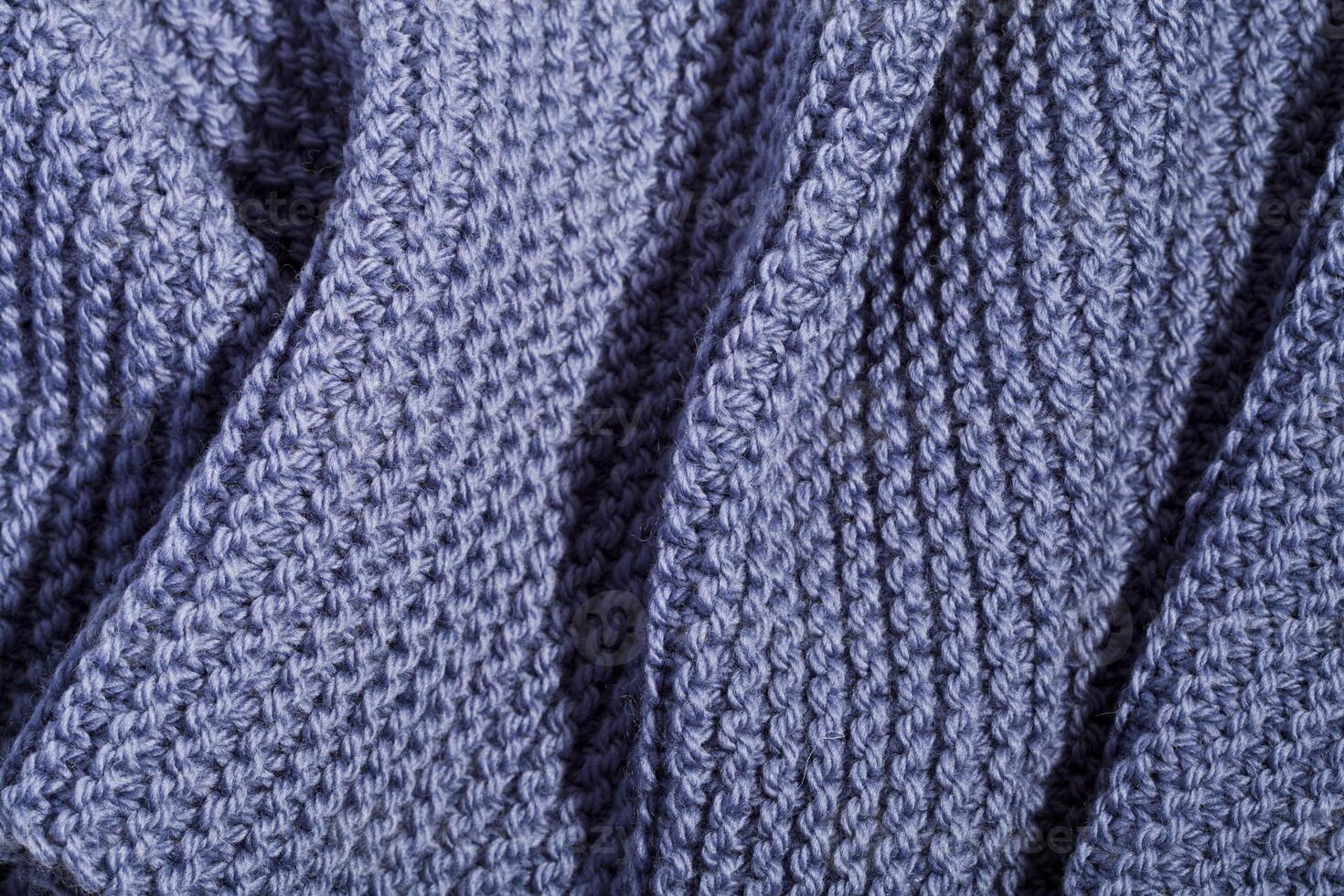 Blue wool knitted scarf. photo