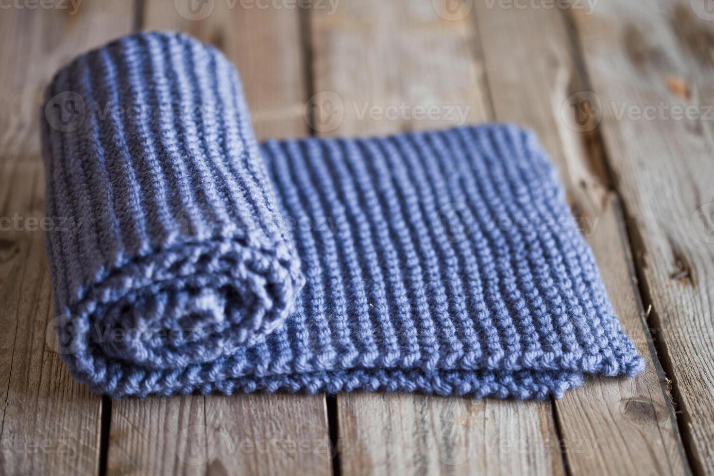 Hand knitted blue scarf. photo