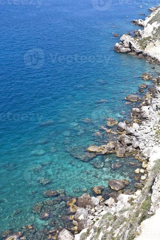Aerial view of rocks on the sea. Overview of the seabed seen from above, transparent water photo