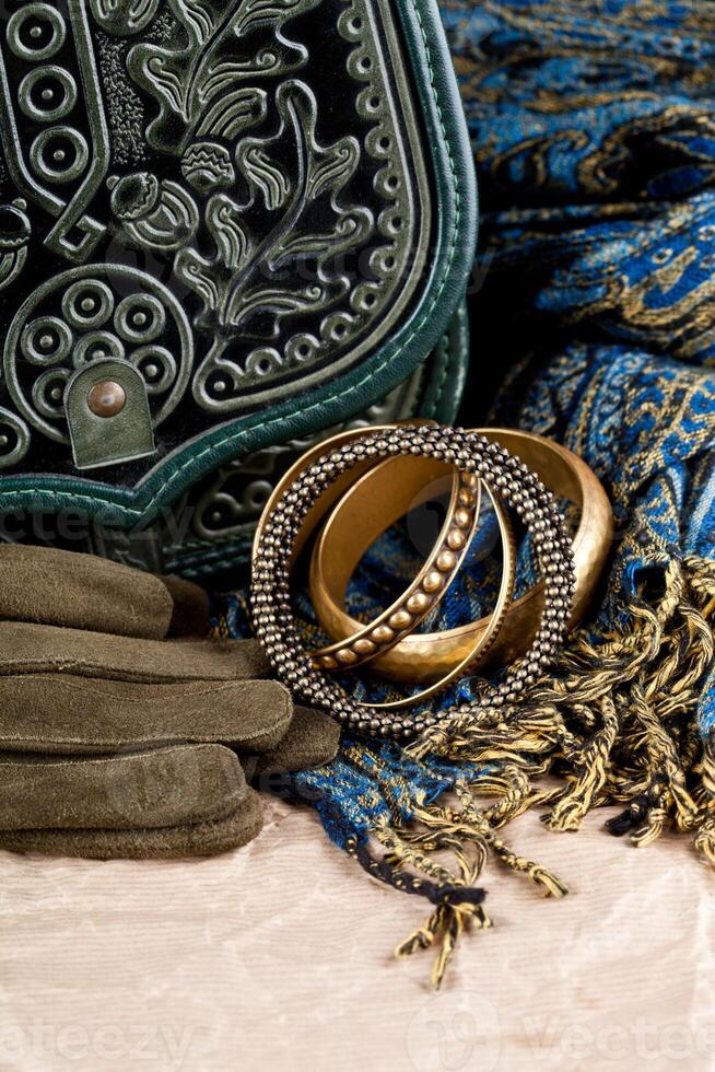 vintage bag, leather gloves, bracelets and scarf photo