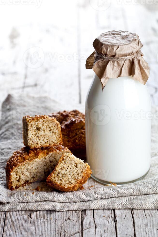 bottle of milk and fresh baked bread photo