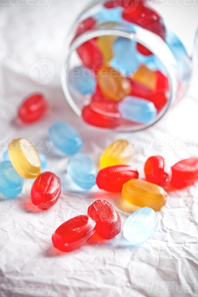 colorful candies in glass jar photo