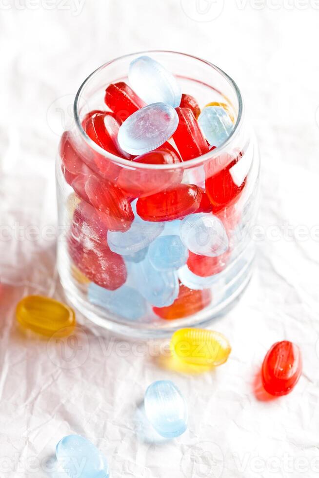 colorful candies in glass jar photo