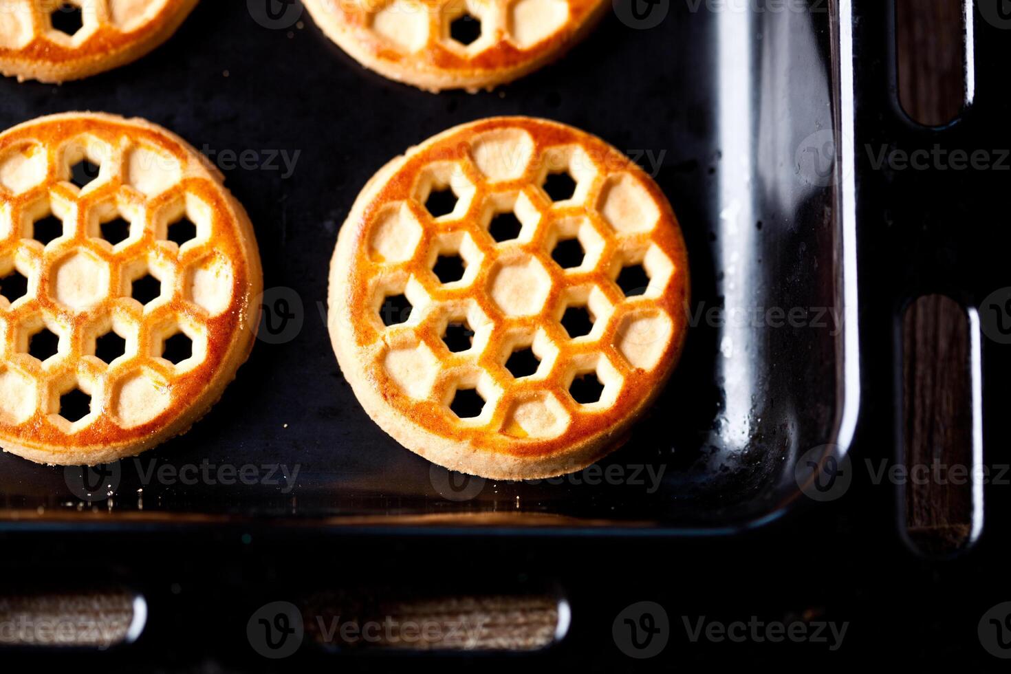 honey cookies on baking sheet photo