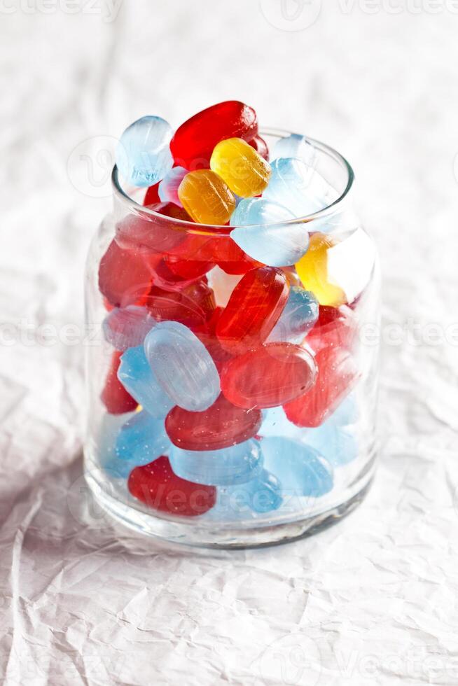 colorful candies in glass jar photo
