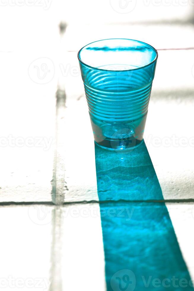 blue empty glass with reflection photo