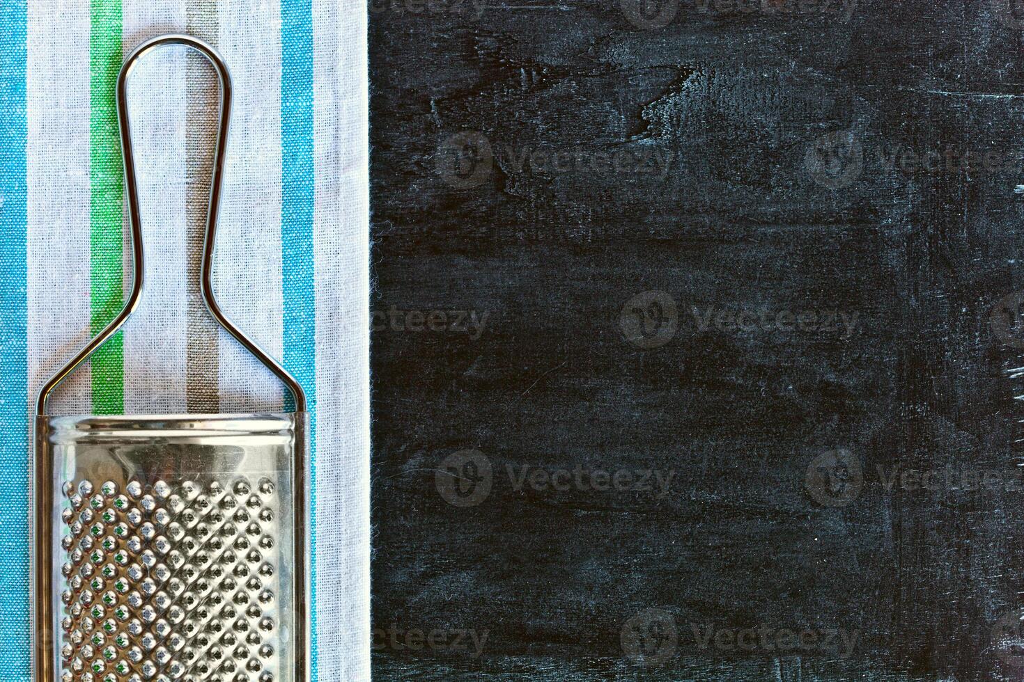 metal grater and tablecloth photo