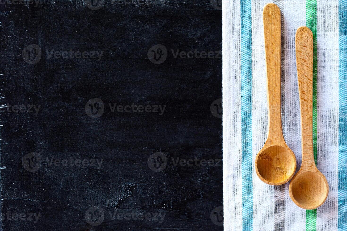 wooden spoons and tablecloth photo