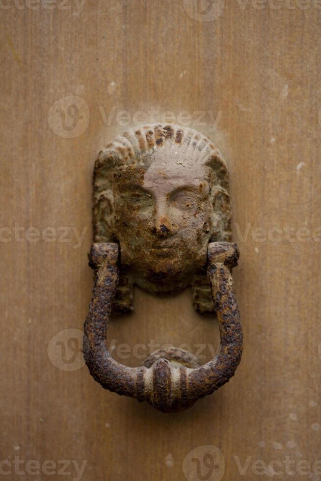 Ancient italian door knocker photo