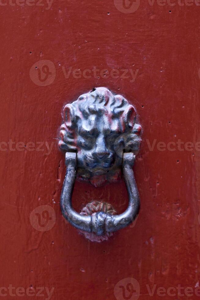 Ancient italian lion shaped door knocker. photo