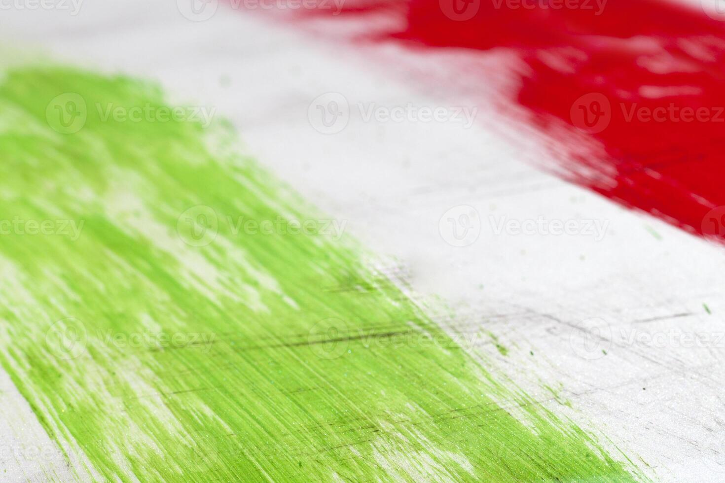 Italian flag painted with brush strokes on white background. photo