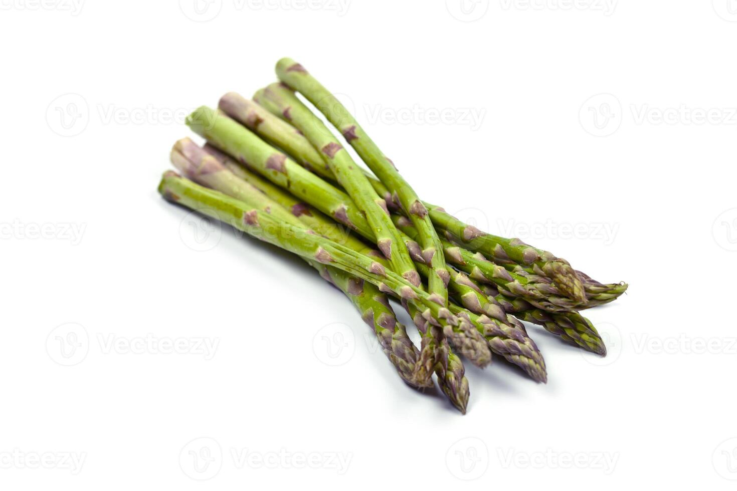 Bunch of fresh raw garden asparagus isolated on white background. Green spring vegetables. photo