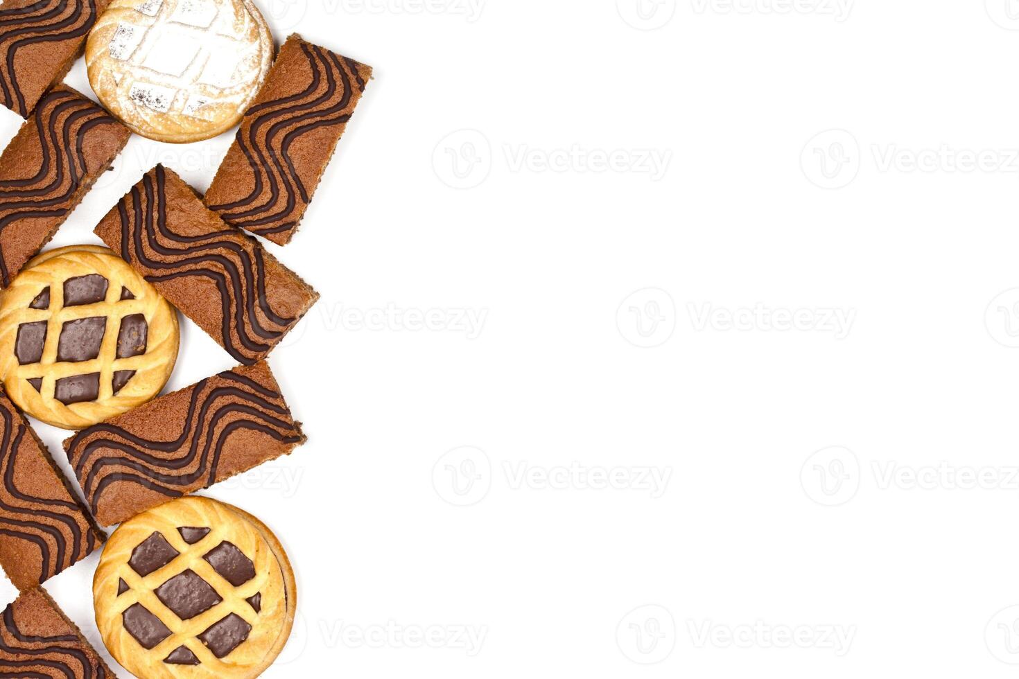 Cake bars filled with cream and tarts with dark chocolate isolated on white background. photo