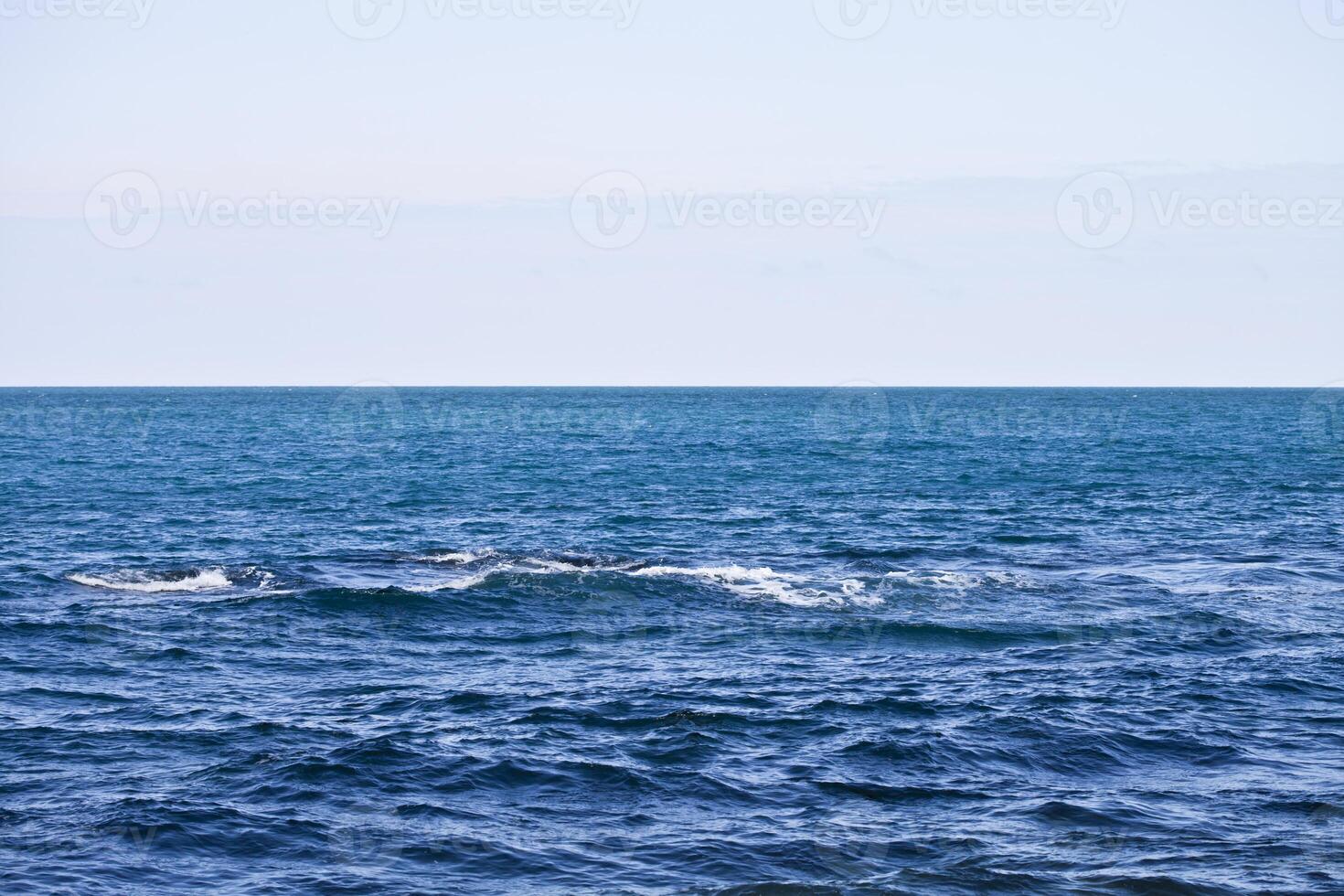 Waving water surface of the Adriatic sea and sky. photo