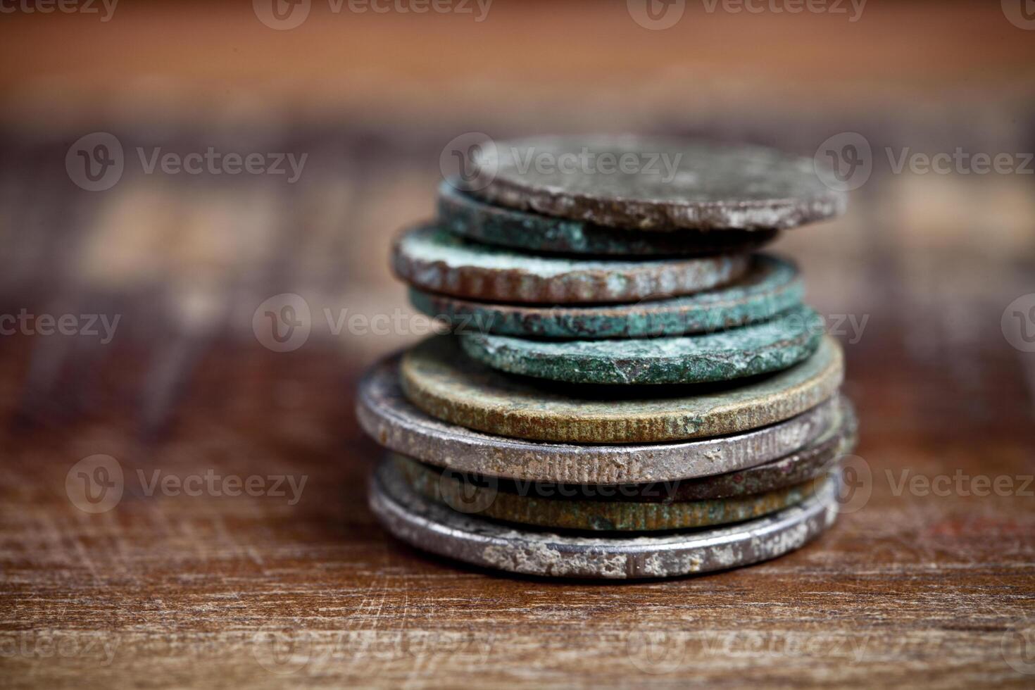 Stack of different ancient copper coins with patina. photo