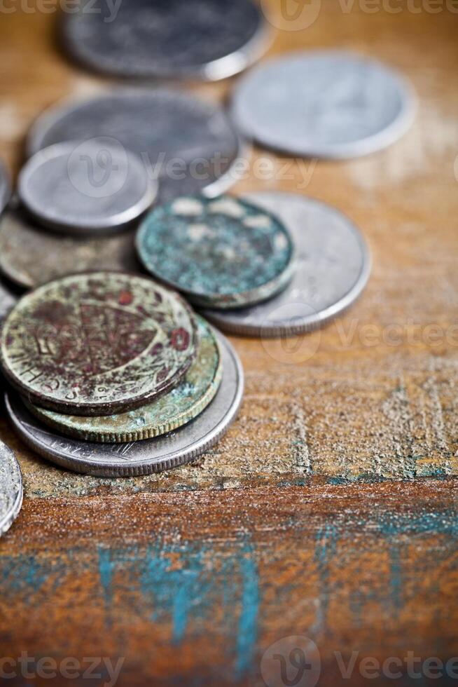 Pile of different ancient copper coins with patina. photo
